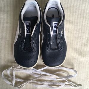 Boy’s navy blue and white Puma tennis shoes